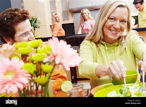 Portrait Of A Mature Couple Sitting At The Dining Table Stock Photo Alamy