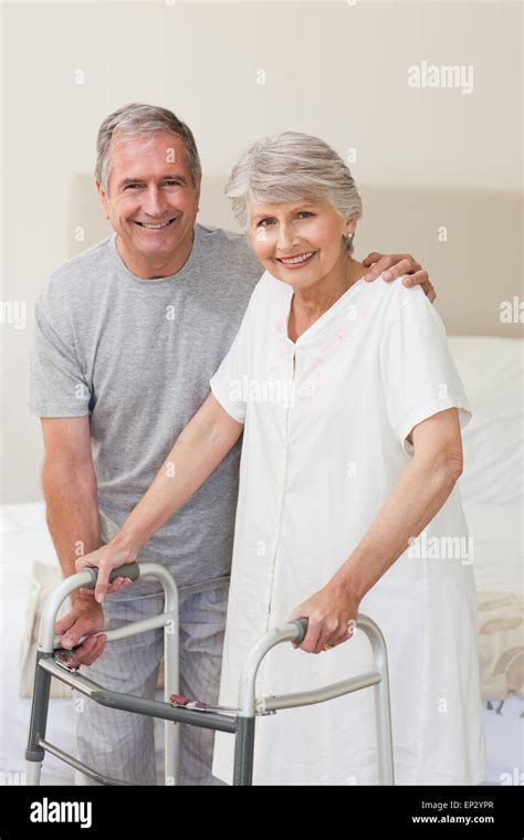 Man Helping His Wife To Walk Stock Photo Alamy