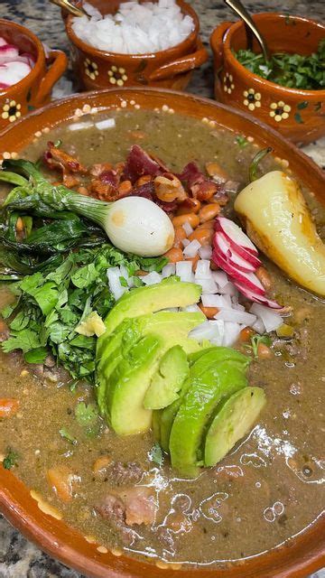 A Large Bowl Filled With Food On Top Of A Table