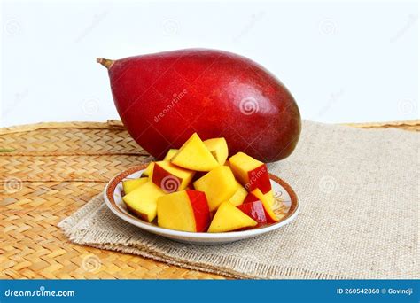 fresh organic indian red totapuri mango fruit  cut pieces closeup