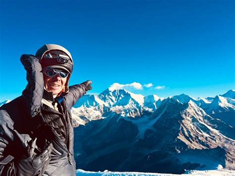 Img Guide Nathan Berry Pointing At Mount Everest From The Summit Of