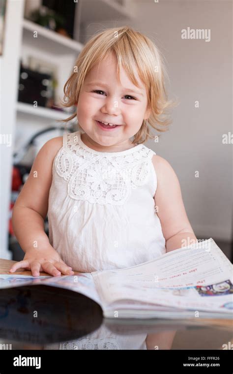Blonde Caucasian Baby Two Years Old Cute Face Looking Happy Smiling Expression White Dress