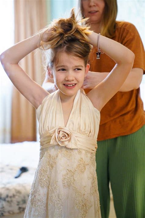 Mom Puts Her Wedding Dress On Her Teenage Daughter Stock Photo Image Of Blonde Fashion