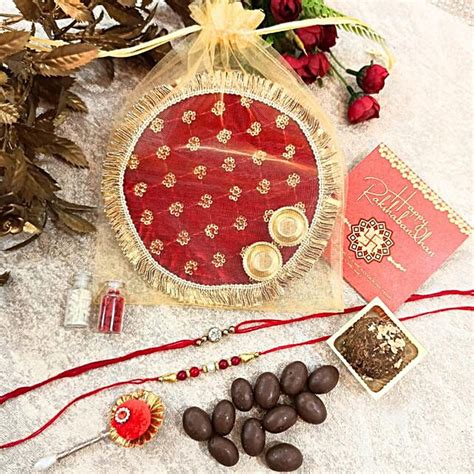 buysend raksha bandhan golden potli hamper  fnp