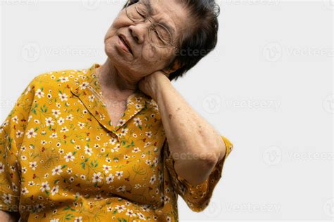 Sick senior woman with back neck and shoulders pain on the joint and