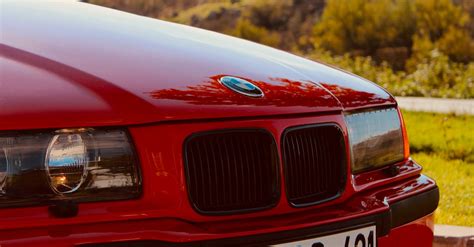 Close Up Shot Of A Red Bmw Car · Free Stock Photo