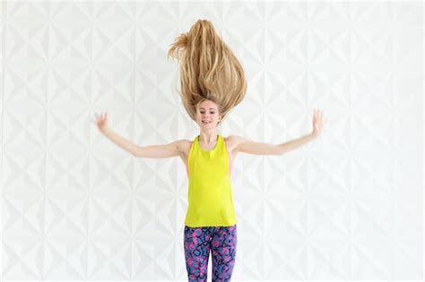 Premium Photo Portrait Of Happy Sporty Fit Woman With Blonde Long Hair