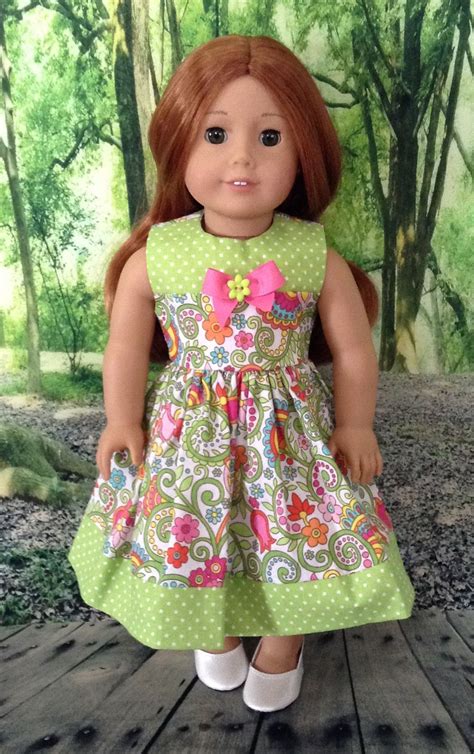 Red Haired Doll In Green Dress And White Shoes