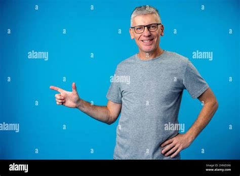 Happy Mature Man Pointing Finger To Copy Space Stock Photo Alamy