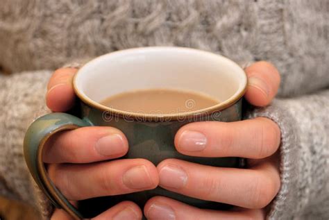 Two Hands Keeping Warm Holding A Hot Cup Of Tea Or Coffee Stock Image Image Of Relax Grey