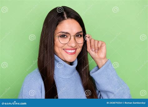 Photo Of Smart Millennial Brunette Lady Hand Eyewear Wear Blue Sweater Isolated On Green Color