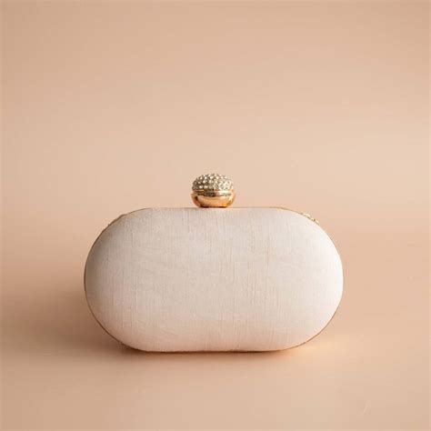 Asha Nude Pink Oval Clutch By Atiya Choudhury