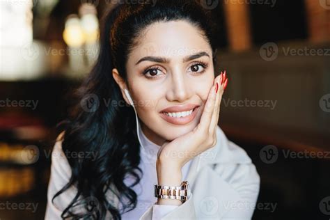 Close Up Portrait Of Beautiful Brunette Female With Dark Warm Eyes Curling Eyelashes Thin Well