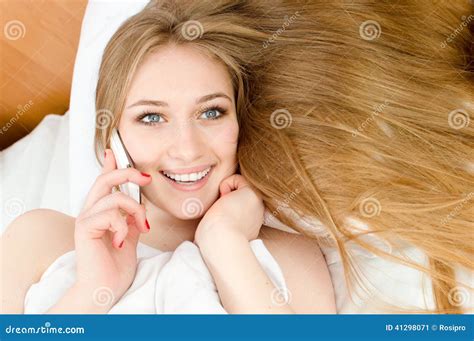 Talking On The Mobile Cell Phone Pretty Blonde Girl With Blue Eyes Red