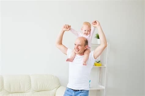 Premium Photo Father Carrying Daughter On Shoulders