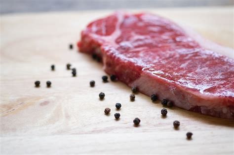 Premium Photo Red Raw Steak Sirloin Against