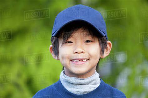 Smiling Korean Boy In Baseball Cap Stock Photo Dissolve