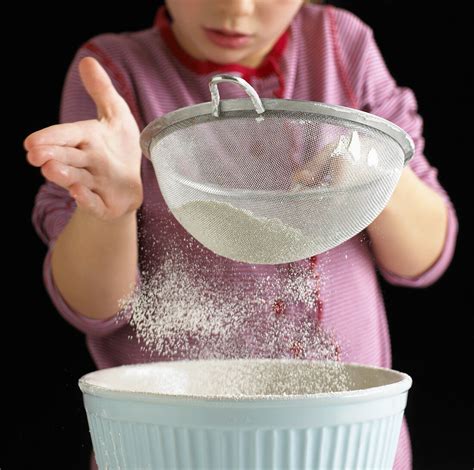 Girl Sieving Flour License Images 371538 Stockfood