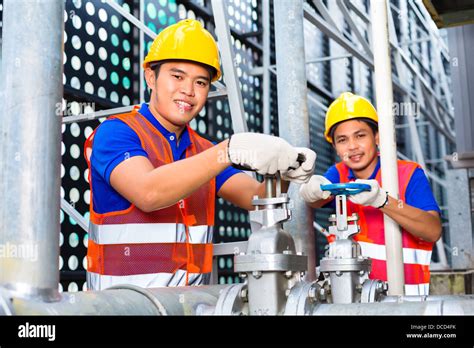 technicians working industrial equipment  res stock photography