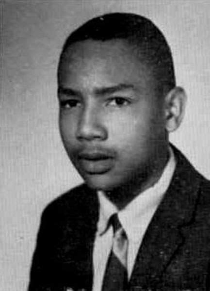 An Old Black And White Photo Of A Man In A Suit