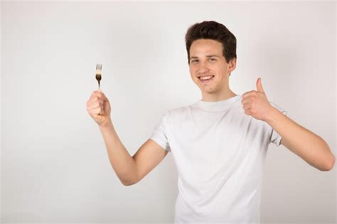 Premium Photo Man With Fork On White