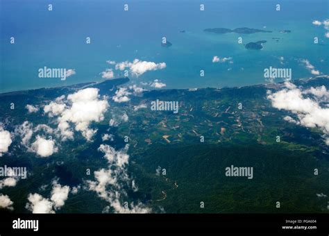 aerial view  land  blue sea  airplane window thailand