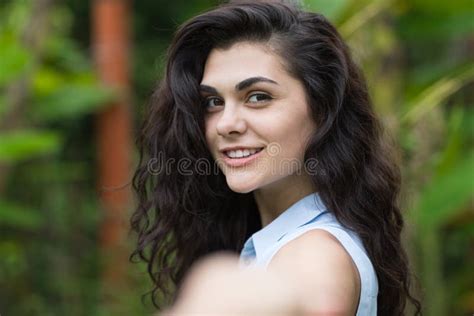 POV Of Beautiful Brunette Woman Holding Male Hand Over Tropical Forest Landscape Stock Image