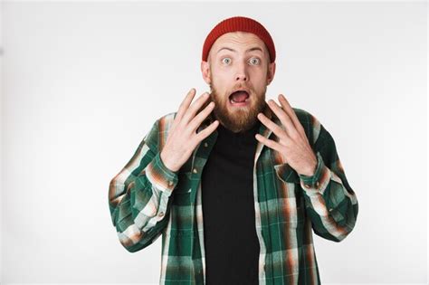 Premium Photo Portrait Of Emotional Bearded Guy Wearing Hat And Plaid