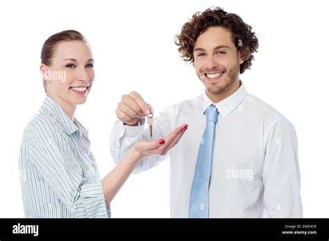 Businessman Handing Over The Key Stock Photo Alamy