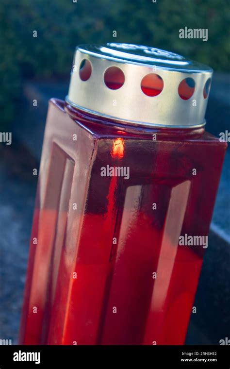A Red Candle In The Cemetery Stock Photo Alamy
