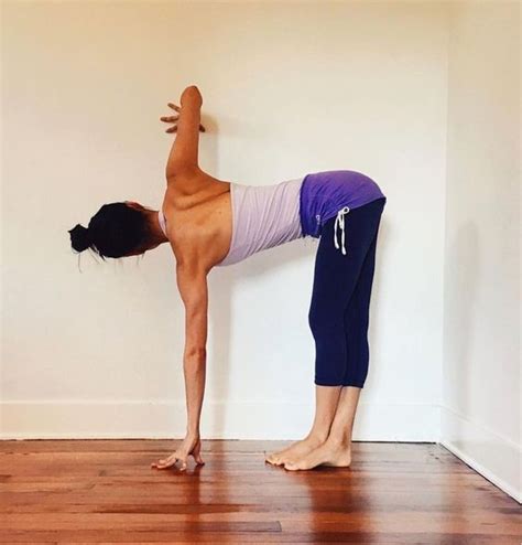 Folded Standing Twist With Wall Assist Yoga Yoga Ashtanga Yoga