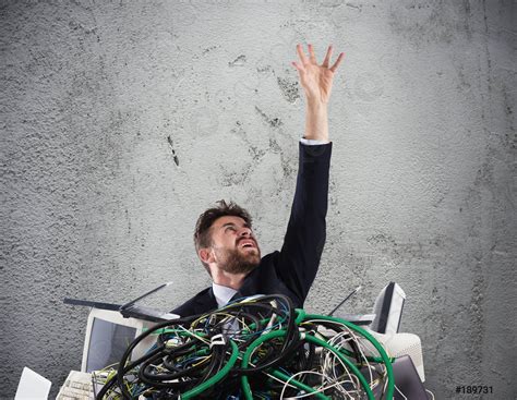 Businessman Trapped By Cables Concept Of Stress And Overwork Stock