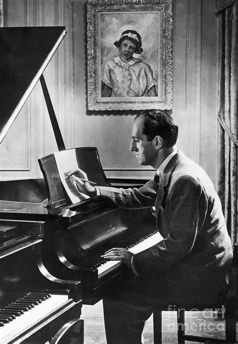 George Gershwin At The Piano By Bettmann