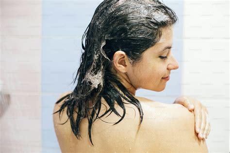 Blurred Defocused Image Of Happy Woman Taking Hot Shower At Home Or