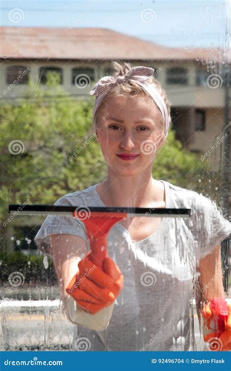 Window Cleaner Using A Squeegee To Wash A Window Stock Photo Image Of