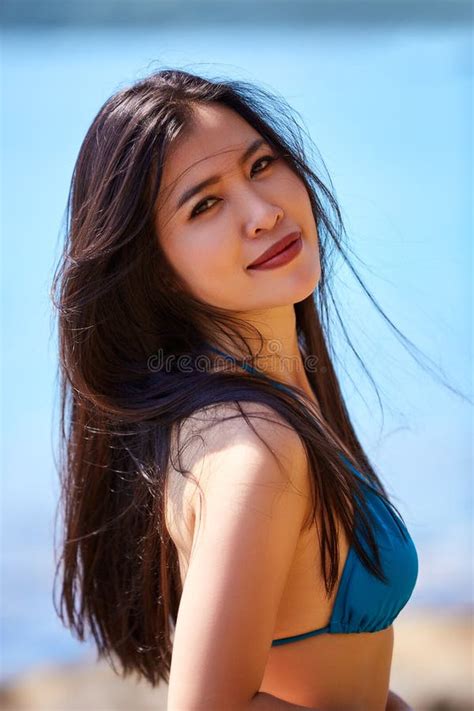 Close Up Portrait Of Beautiful Asian Girl In A Blue Bikini Posing On A Beach Stock Photo Image