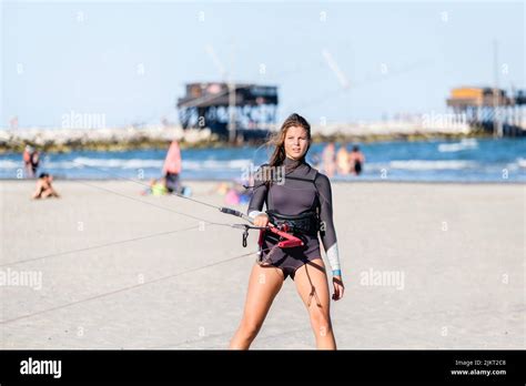 Beautiful Kite Surfing Girl In Pink Bikini Swimsuit Adjusting Kite Surf