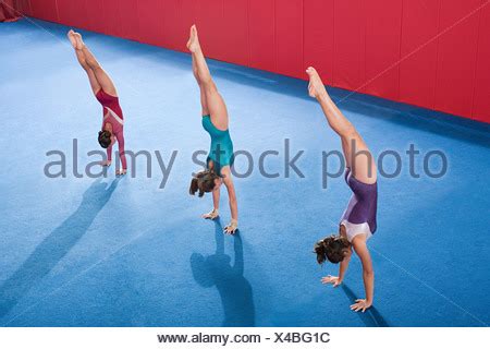 Teenage Girl Doing A Handstand In The Clear Water Of A River Stock