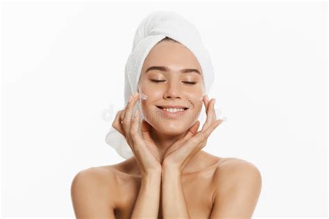 Close Up Beauty Portrait Of A Smiling Beautiful Half Naked Woman Applying Face Cream Isolated