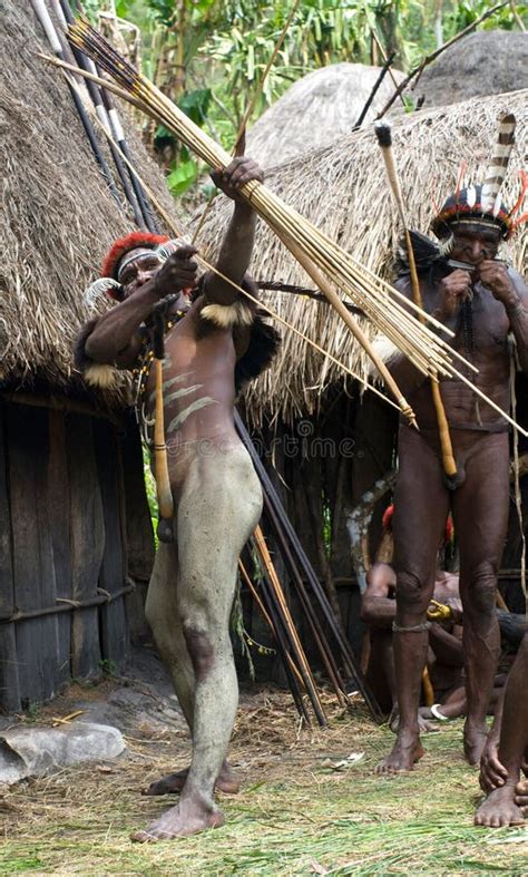 Warrior Of A Papuan Tribe In Traditional Clothes Editorial Image