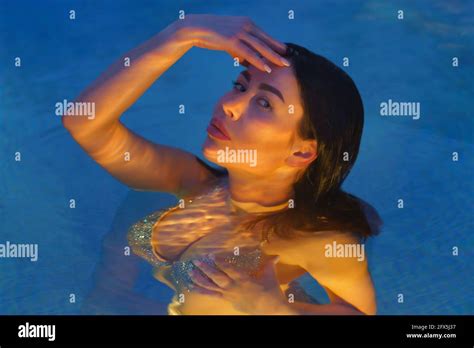 Pretty Brunette In Swimsuit Swimming Hi Res Stock Photography And Images Alamy