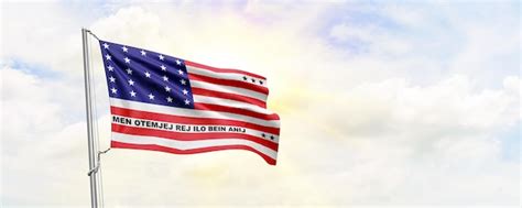 Premium Photo Bikini Atoll Flag Waving On Sky Background 3d Rendering