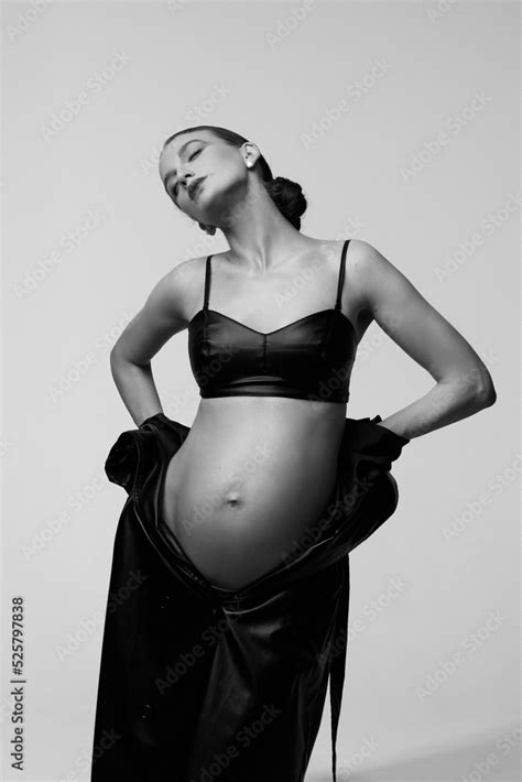 Beautiful Pregnant Woman In Black Trench Coat And High Heels Naked Belly Stylish Girl In
