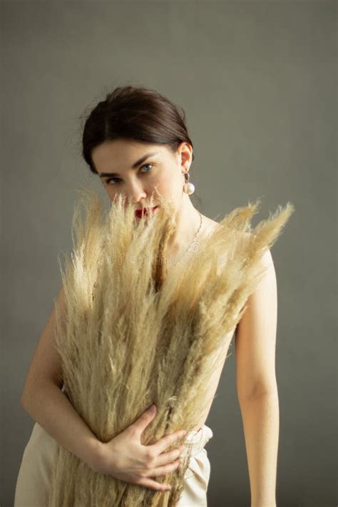 Beautiful Naked Woman With Black Hair And Dry Flowers Beauty Face Stock Photo Image Of Makeup