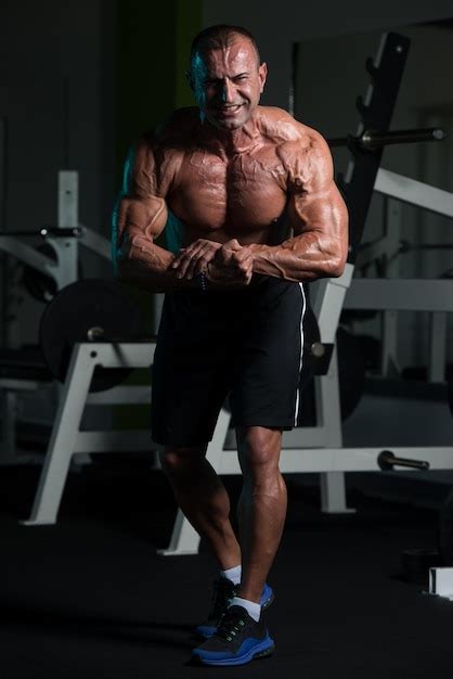 Premium Photo Portrait Of A Mature Physically Fit Man Showing His Well Trained Body Muscular