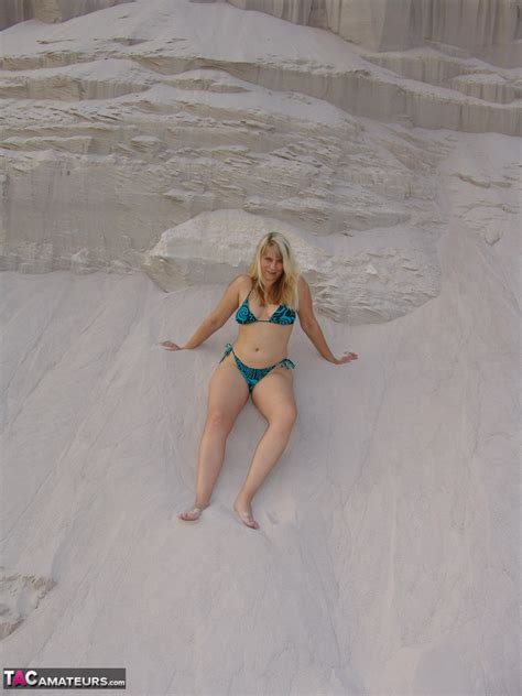 Mature Blonde Sweet Susi Doffs A Bikini To Pose Naked In A Sand Pit 425263549