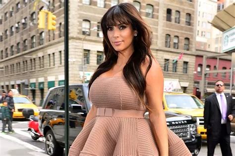 Kim Kardashian Shows Off Her Blooming Bosoms In Low Cut Top As She Ditches Maternity For Nude