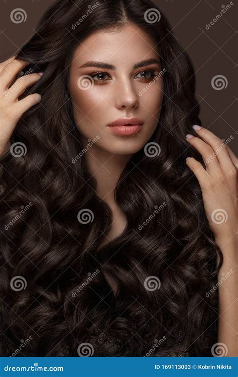 Beautiful Brunette Model Curls Classic Makeup And Full Lips The Beauty Face Stock Image