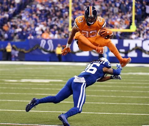 Watch Broncos Devontae Booker Hurdles Colts Defender The Denver Post