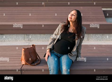 Urban Portrait Of A Modern Pregnant Latina Woman Pregnancy And